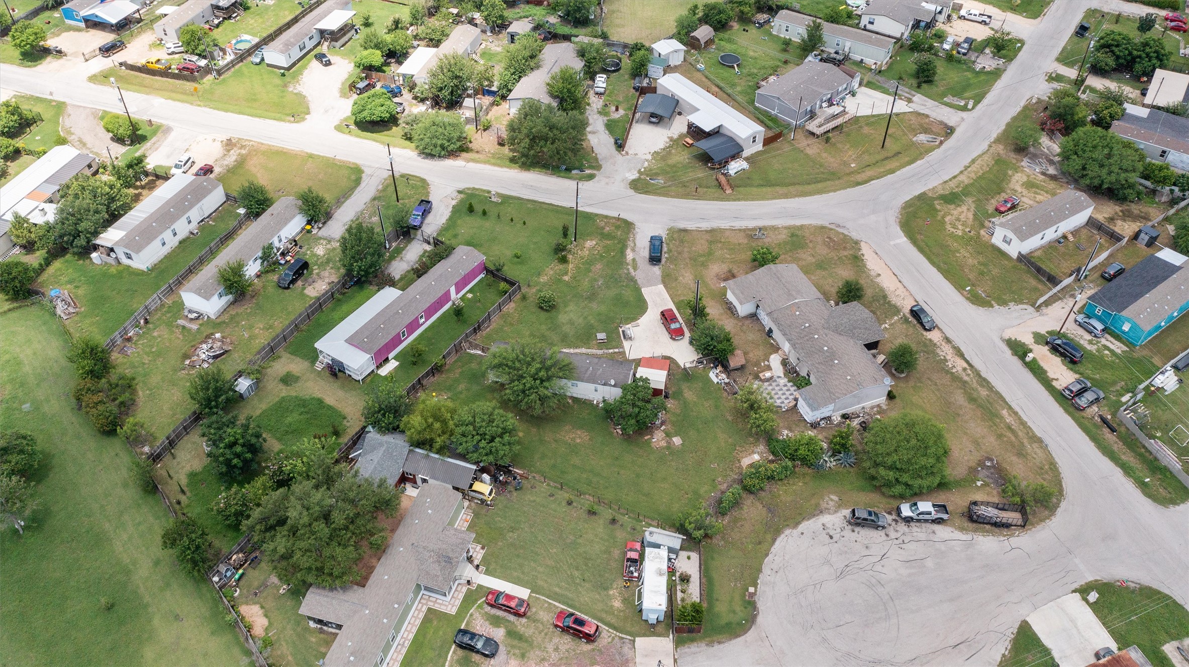 218 Boxcar Path Kyle, TX 78640 - Photo 16 of 21 An aerial perspective reveals a network of roads and residences, defining a quiet neighborhood.