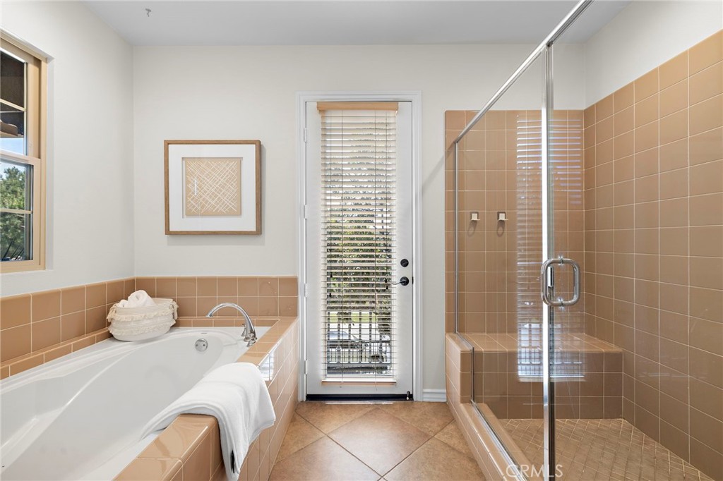 47 Tuscany Ladera Ranch, CA 92694 - Photo 16 of 28 a bedroom with a bed and a window