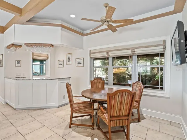 a bathroom with a granite countertop sink a toilet a mirror and shower