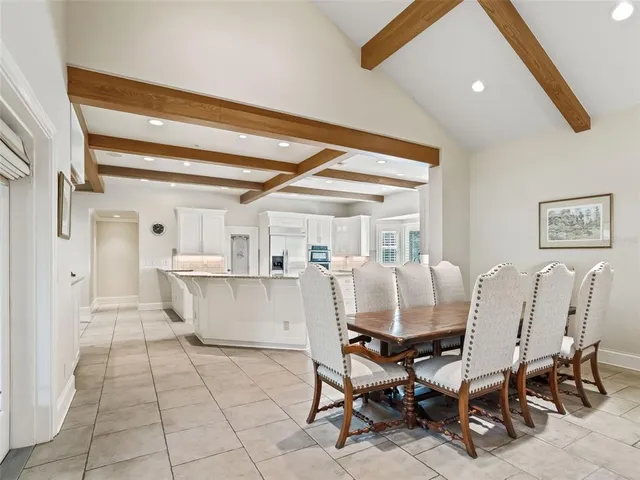 a living room with furniture a piano and a window