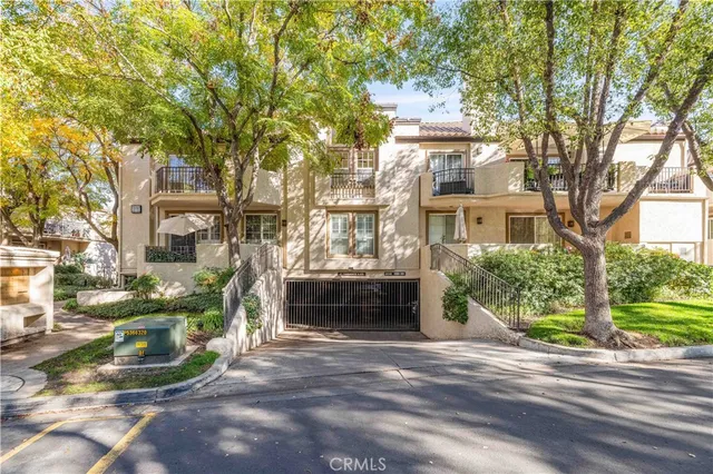 an aerial view of a house with a yard and garden