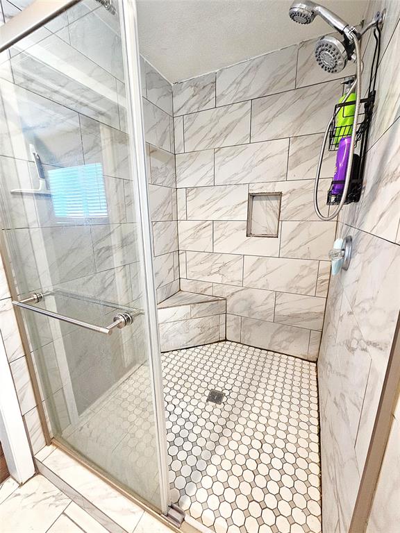 1205 West Trinity Street Groesbeck, TX 76642 - Photo 12 of 28 a bathroom with a shower