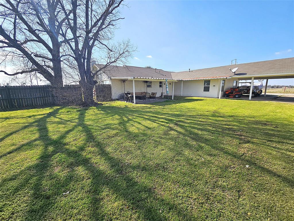 1205 West Trinity Street Groesbeck, TX 76642 - Photo 22 of 28 a view of a house with a swimming pool