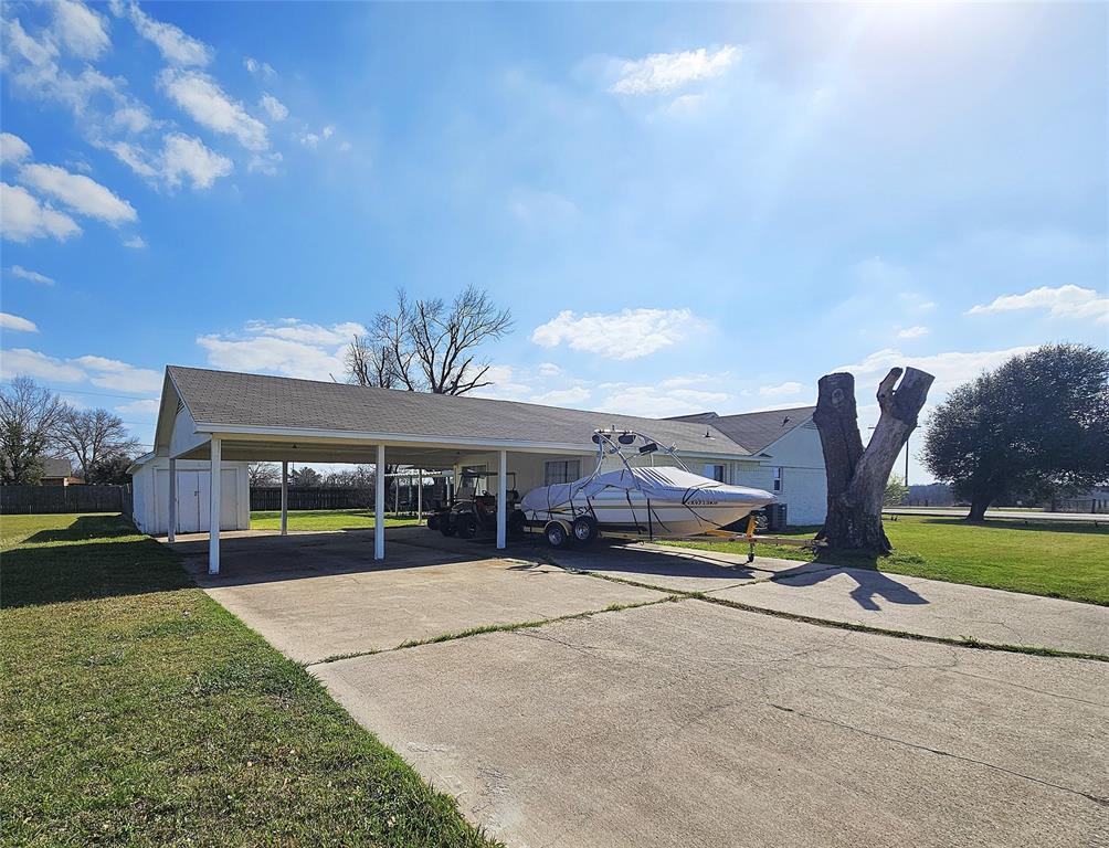 1205 West Trinity Street Groesbeck, TX 76642 - Photo 25 of 28 a view of a house with backyard and porch