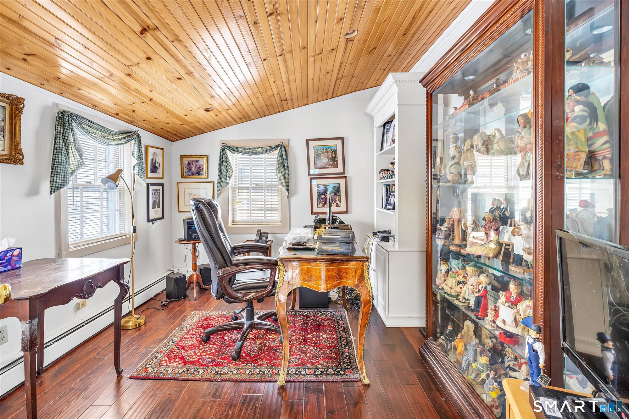 5695 Main Street Stratford, CT 06614 - Photo 14 of 40 a living room with furniture and a flat screen tv