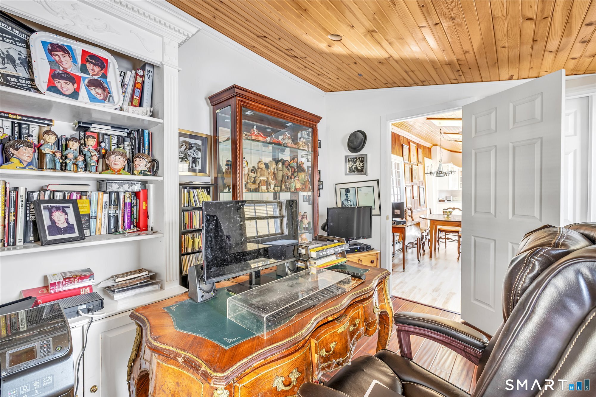 5695 Main Street Stratford, CT 06614 - Photo 15 of 40 a living room with furniture and a book shelf