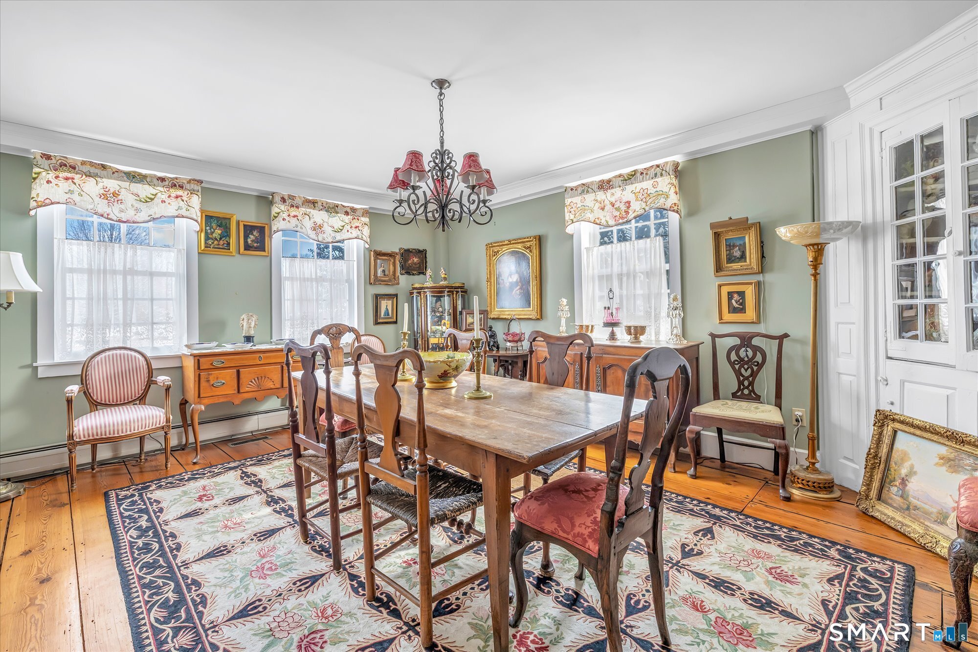 5695 Main Street Stratford, CT 06614 - Photo 24 of 40 a view of a dining room with furniture and chandelier