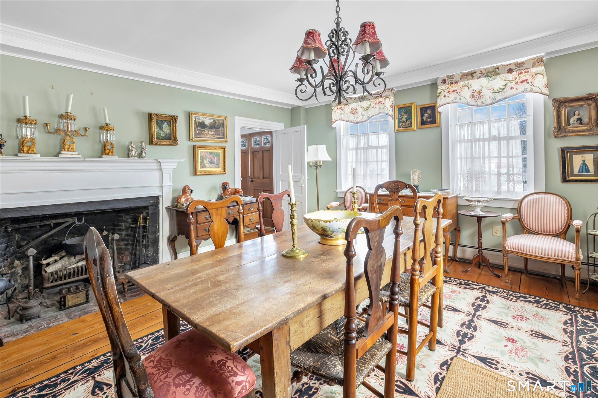 5695 Main Street Stratford, CT 06614 - Photo 25 of 40 a dining room with furniture a rug and wooden floor