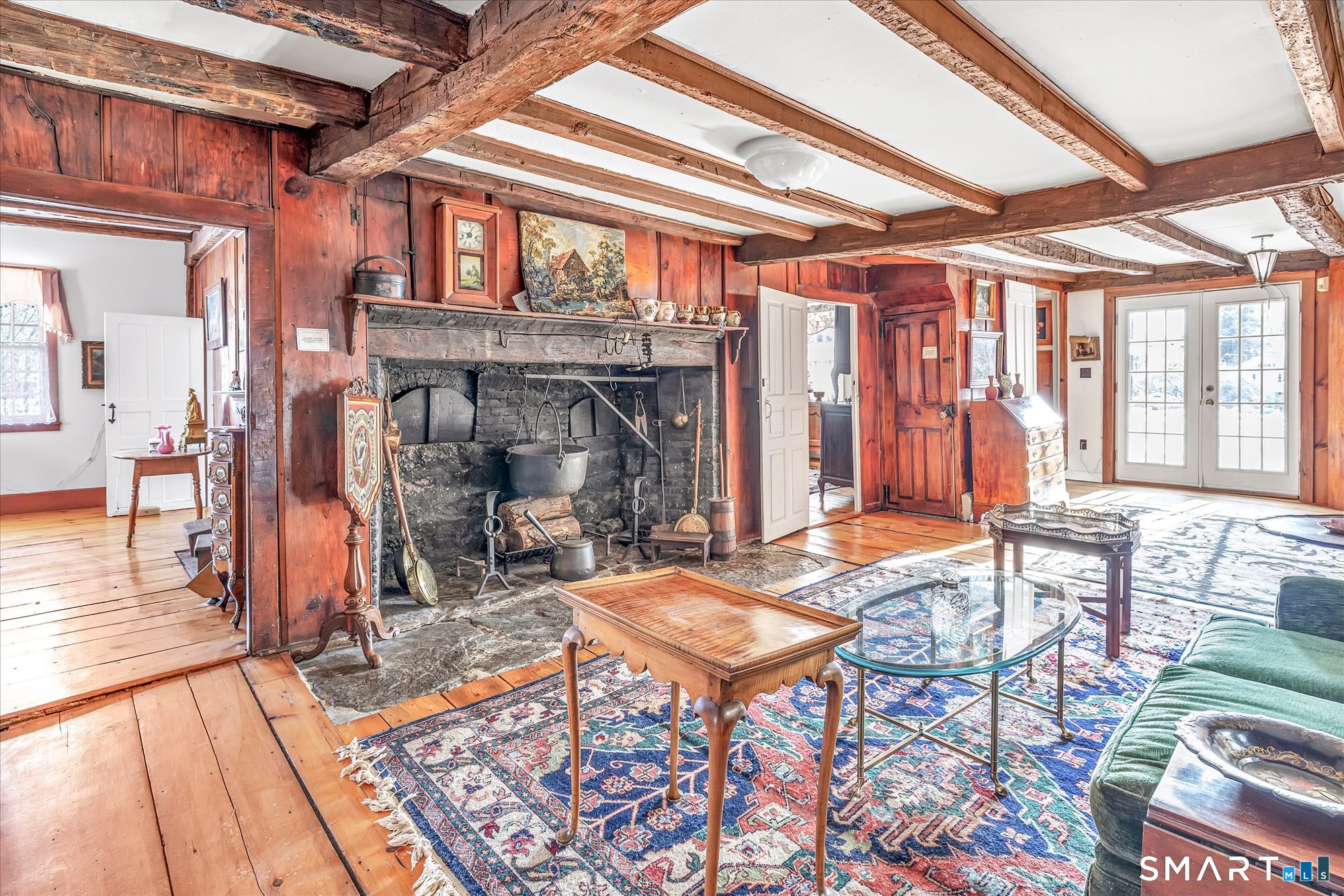 5695 Main Street Stratford, CT 06614 - Photo 26 of 40 a living room with fireplace furniture and a floor to ceiling window