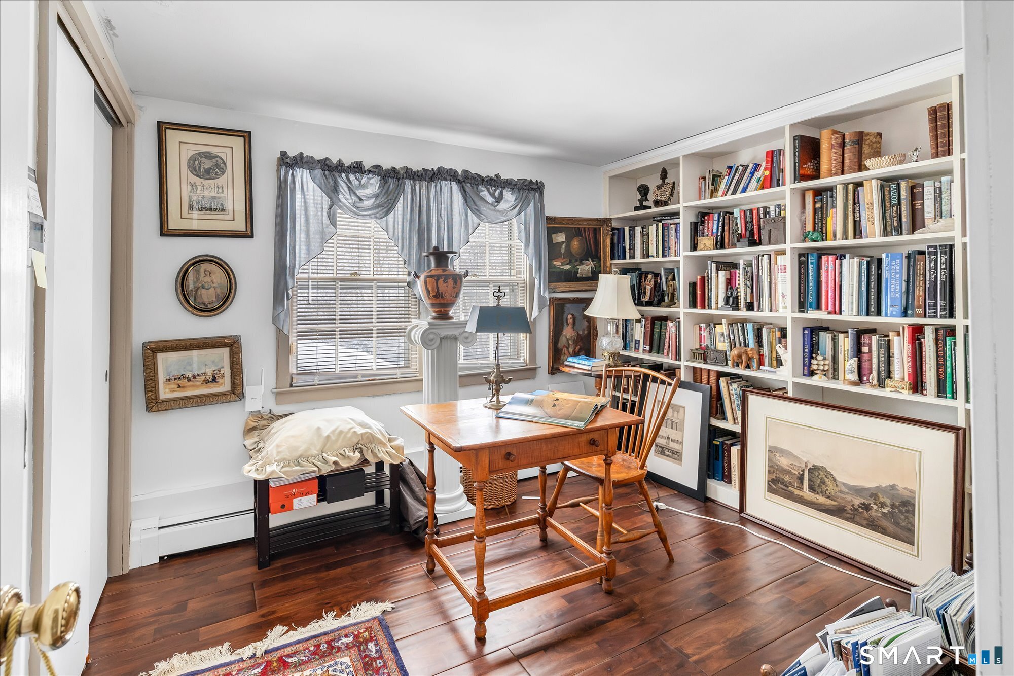 5695 Main Street Stratford, CT 06614 - Photo 32 of 40 a bedroom with furniture and a book shelf