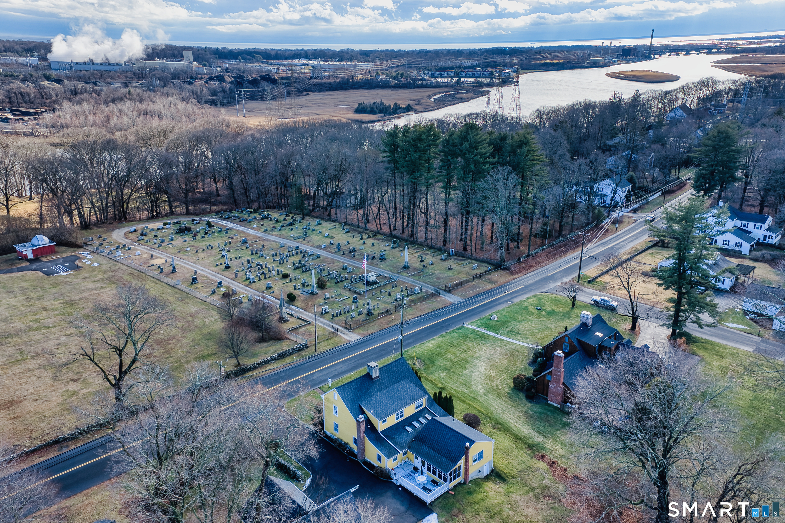 5695 Main Street Stratford, CT 06614 - Photo 5 of 40 a view of a backyard with wooden fence