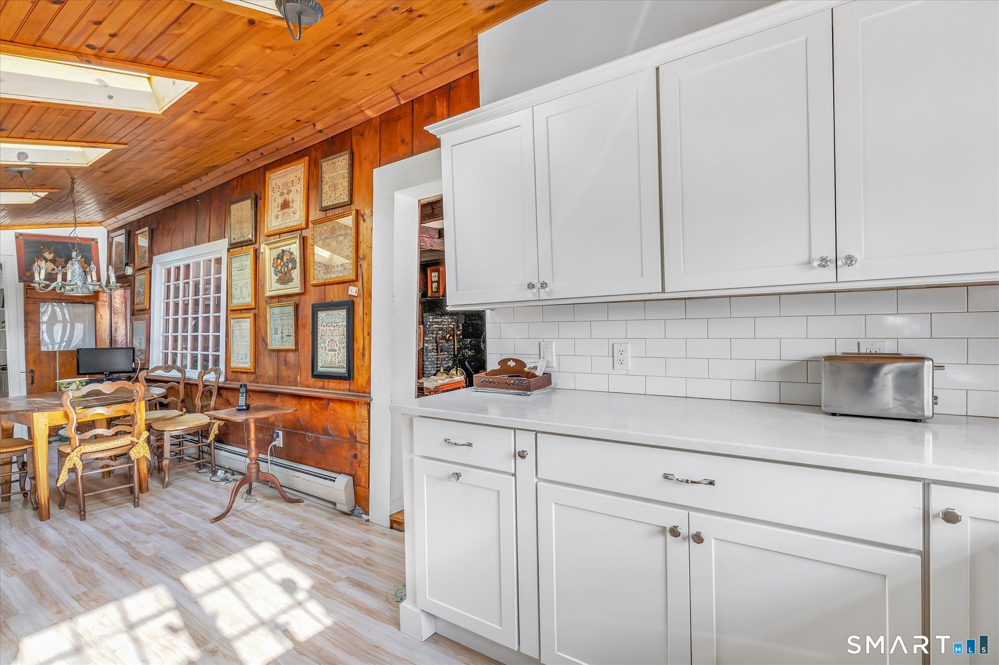 5695 Main Street Stratford, CT 06614 - Photo 10 of 40 a kitchen with stainless steel appliances granite countertop a stove a sink and white cabinets