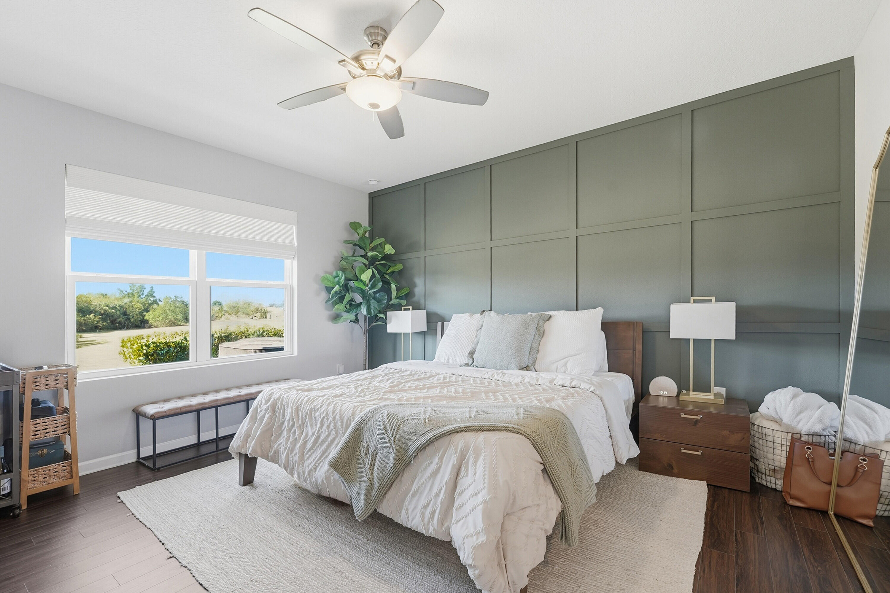 3113 Yellowstone Circle Fort Pierce, FL 34945 - Photo 13 of 33 a bedroom with a large bed and a chandelier