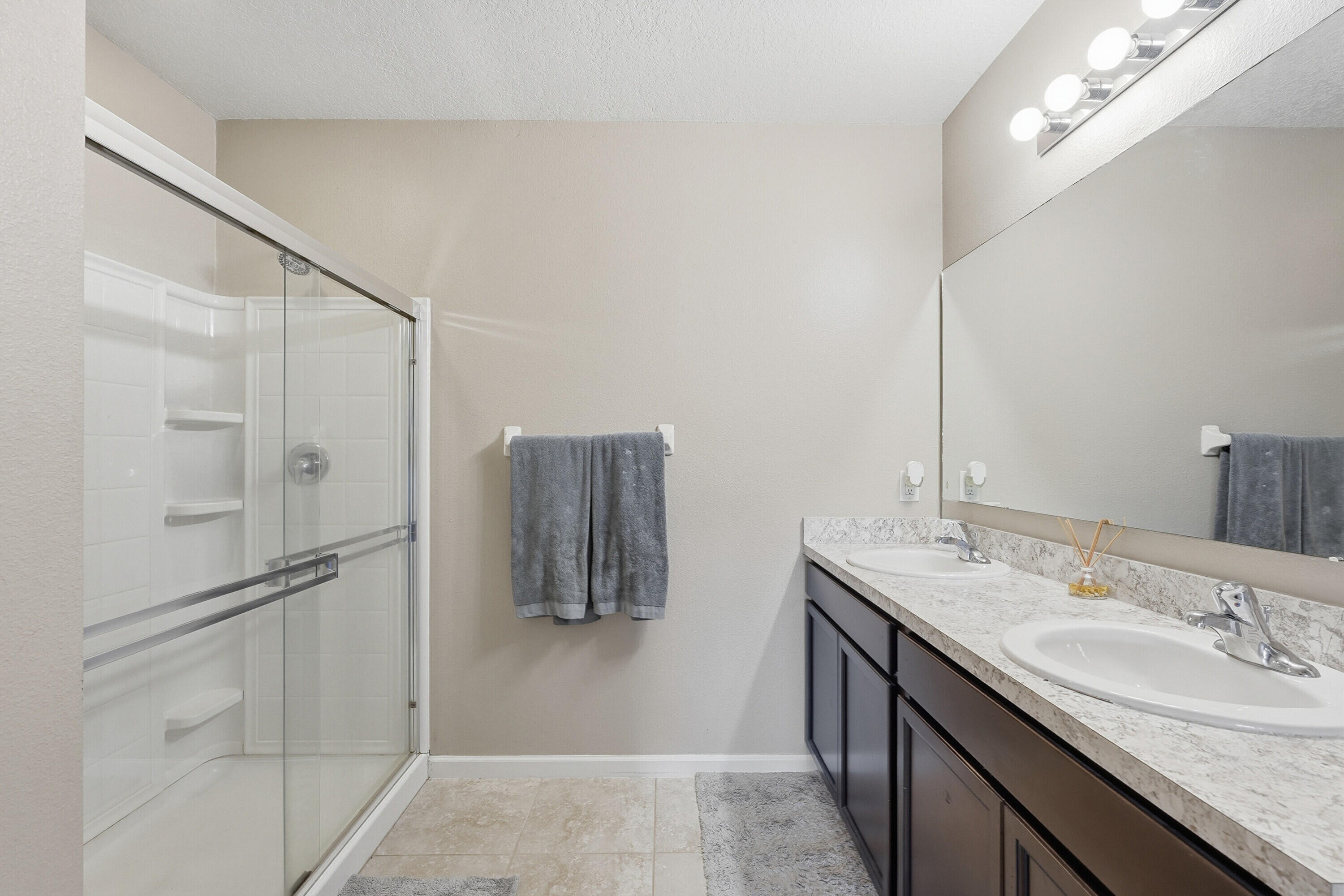3113 Yellowstone Circle Fort Pierce, FL 34945 - Photo 16 of 33 a bathroom with a granite countertop shower sink and mirror