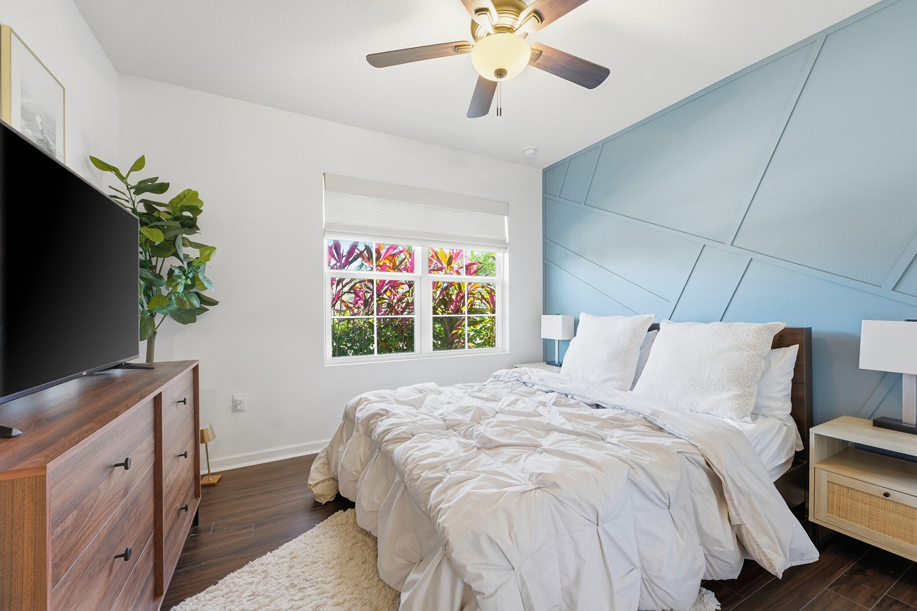 3113 Yellowstone Circle Fort Pierce, FL 34945 - Photo 17 of 33 a bedroom with a bed and a flat screen tv