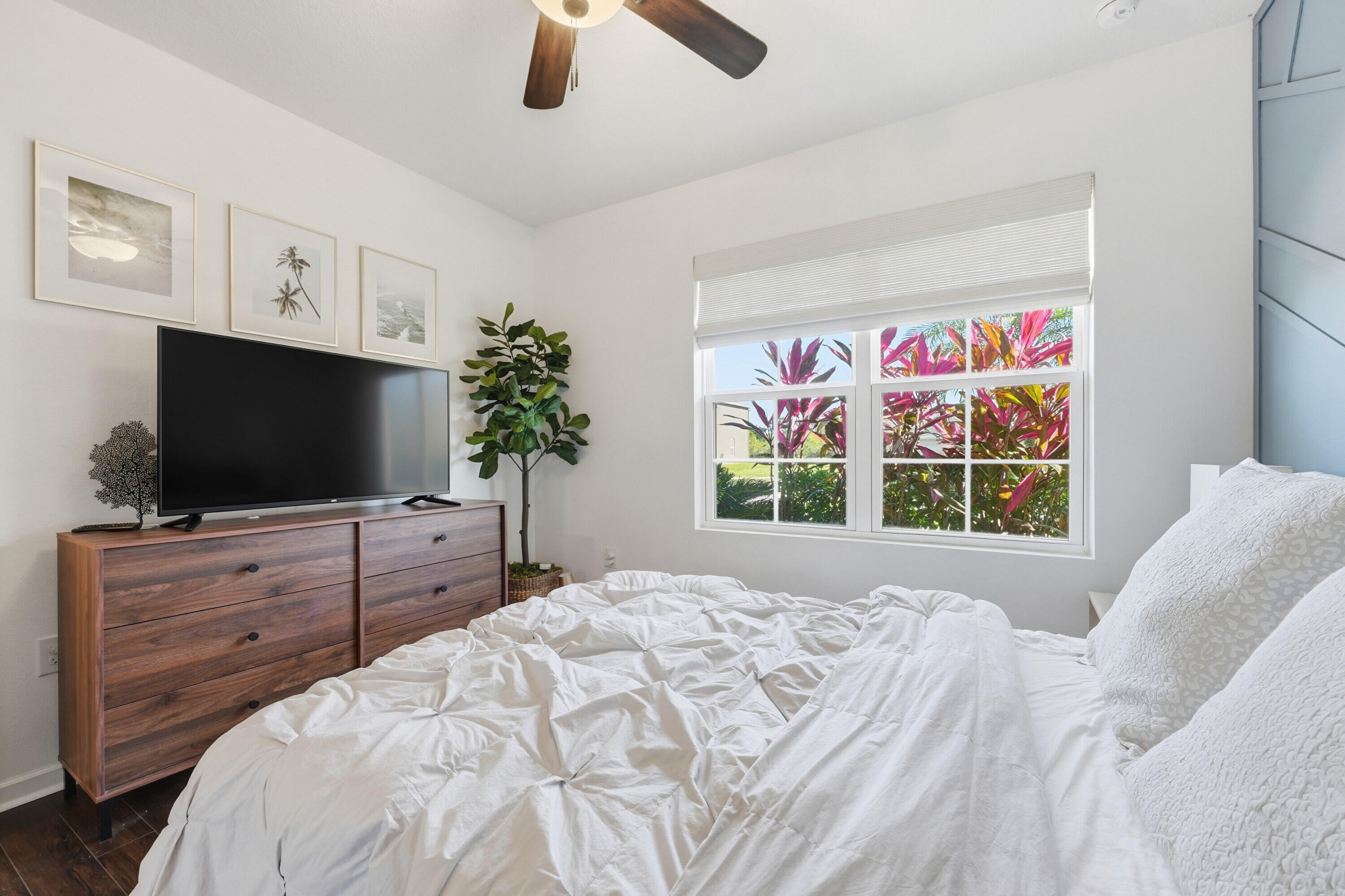 3113 Yellowstone Circle Fort Pierce, FL 34945 - Photo 19 of 33 a bedroom with a bed and a flat screen tv