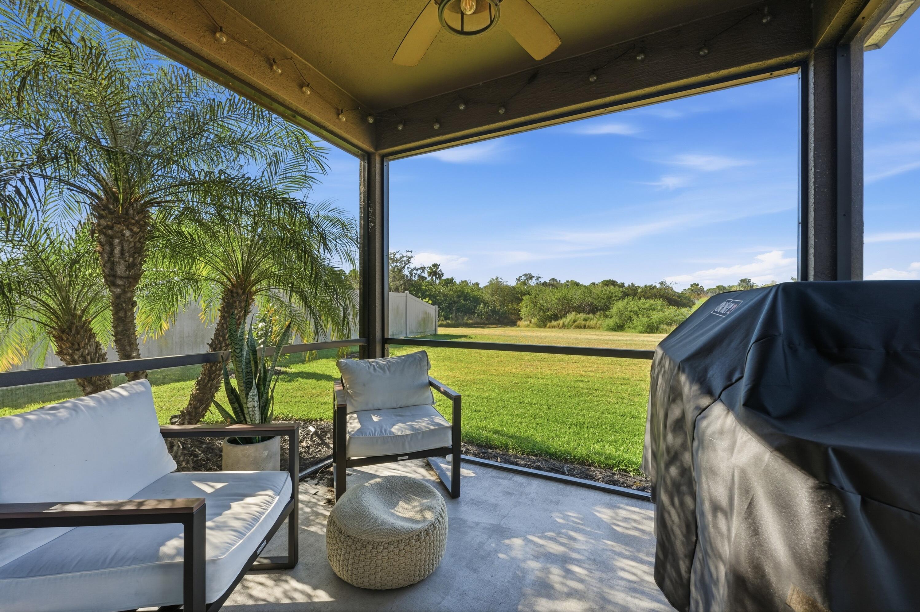 3113 Yellowstone Circle Fort Pierce, FL 34945 - Photo 24 of 33 a view of a chairs and table in patio
