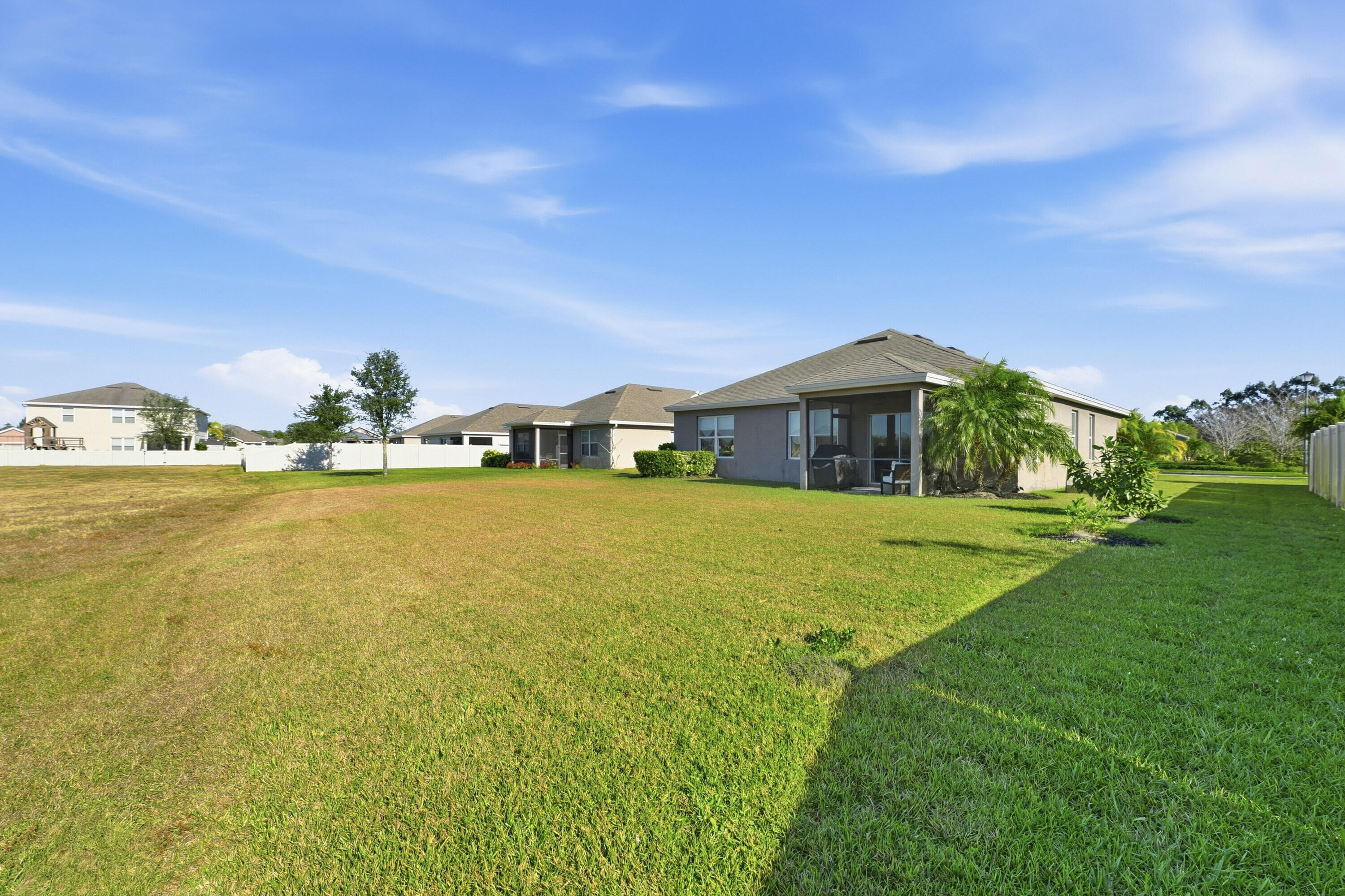 3113 Yellowstone Circle Fort Pierce, FL 34945 - Photo 25 of 33 a front view of house with yard and green space