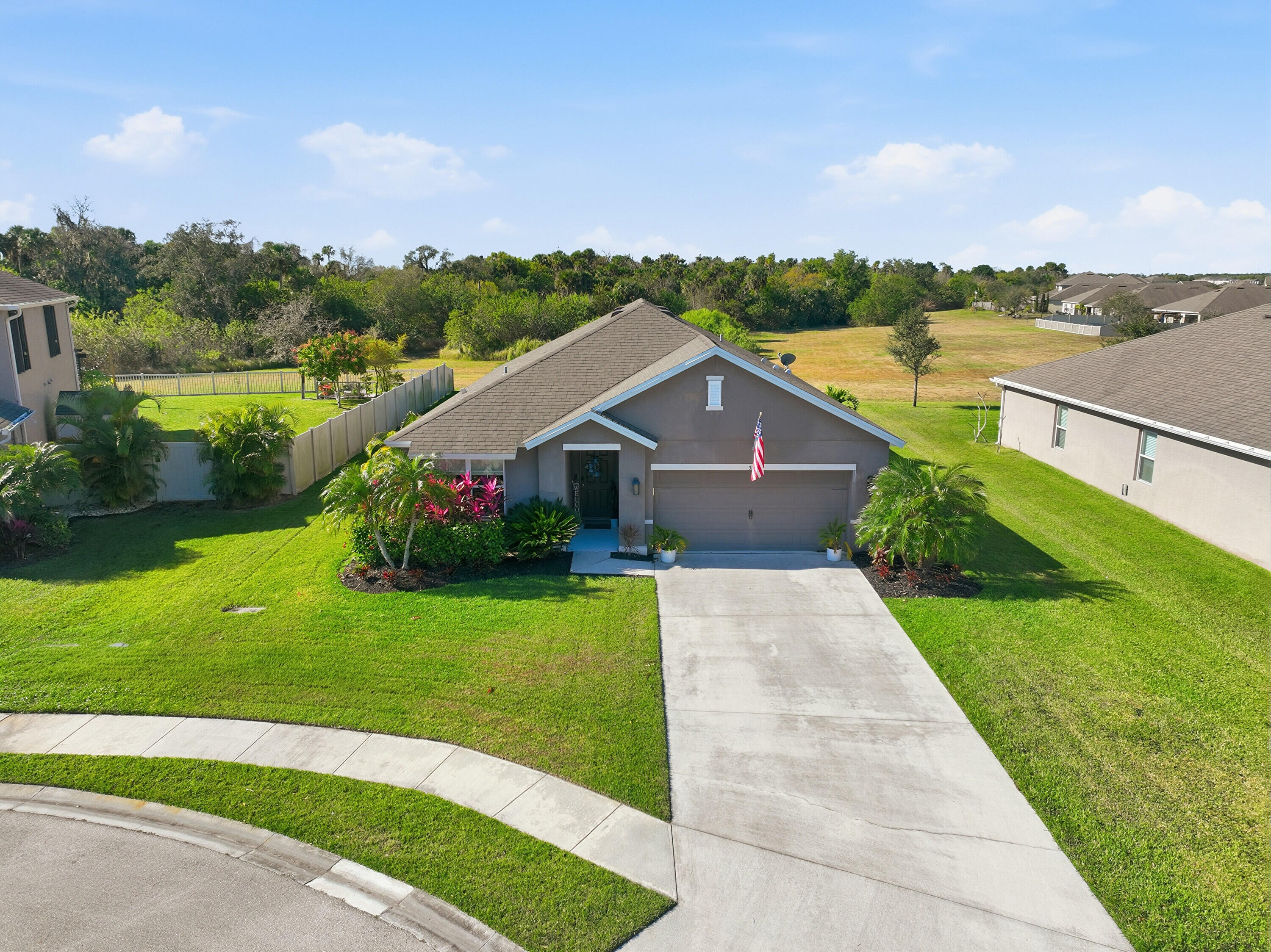 3113 Yellowstone Circle Fort Pierce, FL 34945 - Photo 27 of 33 a front view of a house with a yard