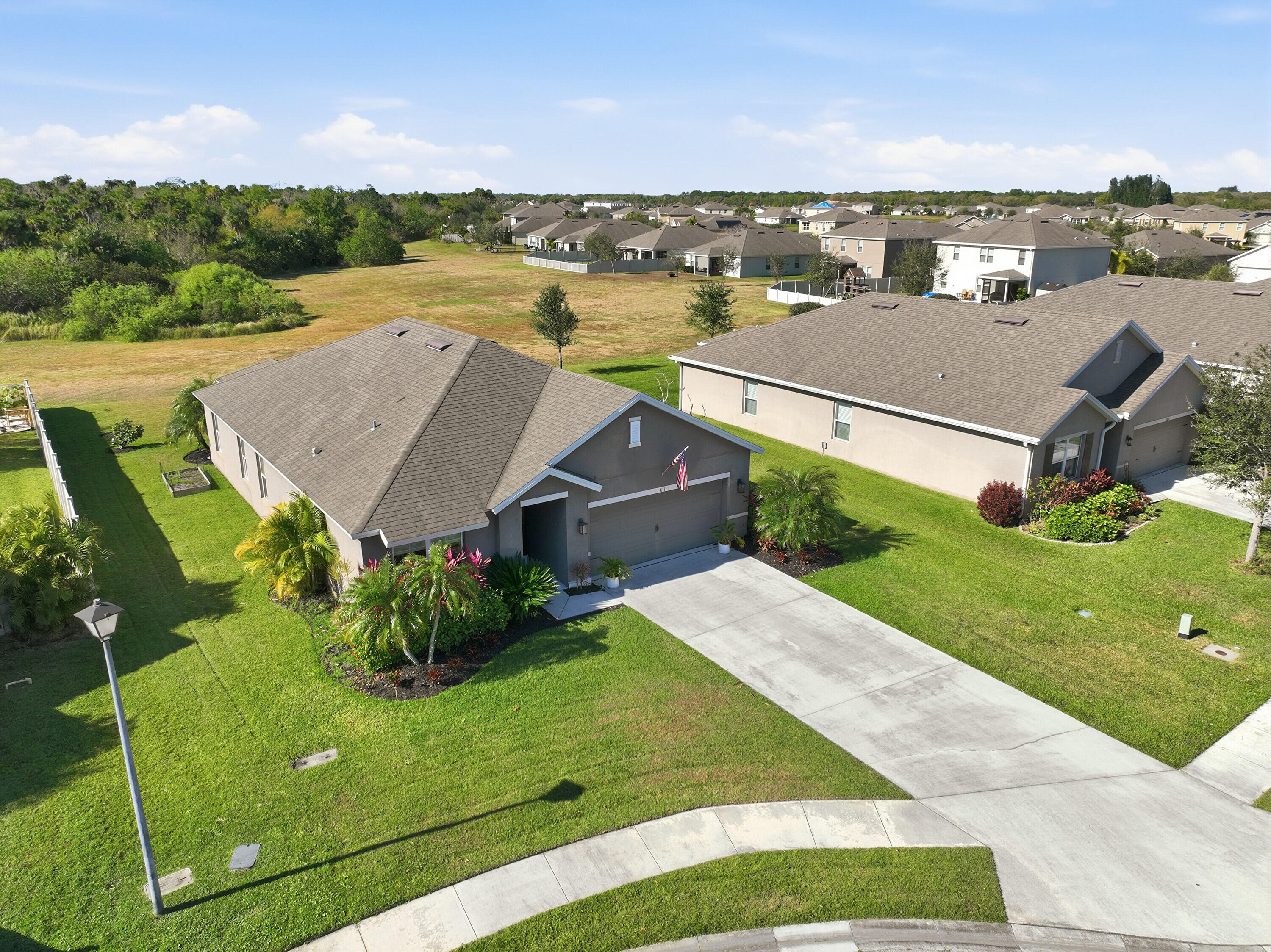 3113 Yellowstone Circle Fort Pierce, FL 34945 - Photo 29 of 33 an aerial view of a house with a big yard