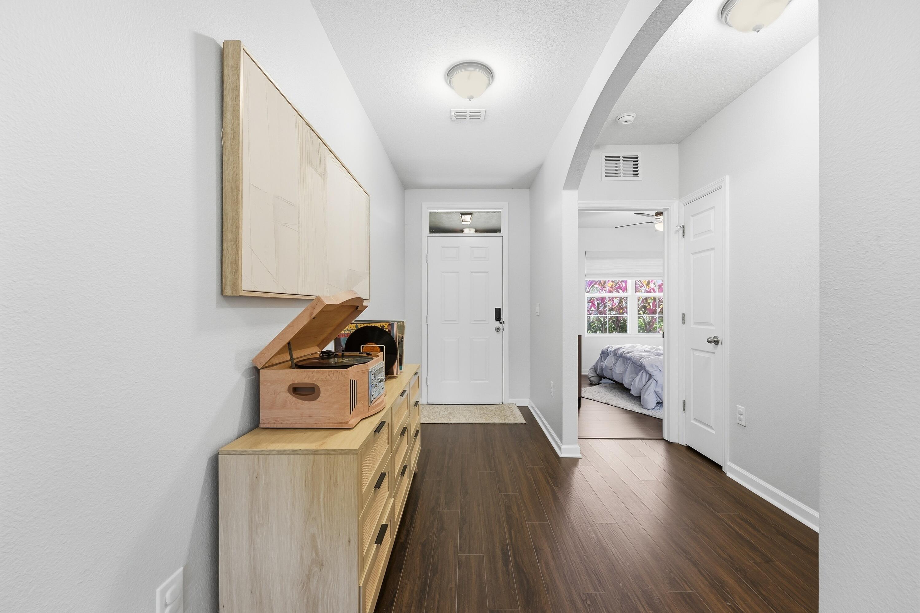 3113 Yellowstone Circle Fort Pierce, FL 34945 - Photo 3 of 33 a view of a storage & utility room with wooden floor