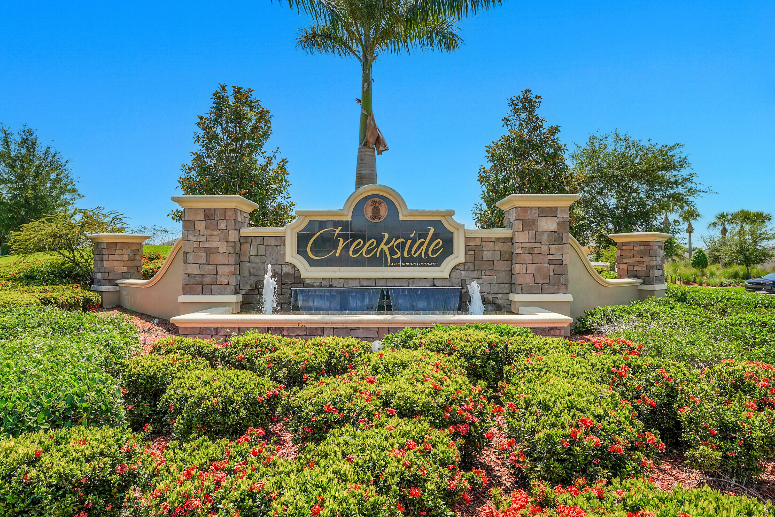 3113 Yellowstone Circle Fort Pierce, FL 34945 - Photo 32 of 33 a view of street sign under a palm tree