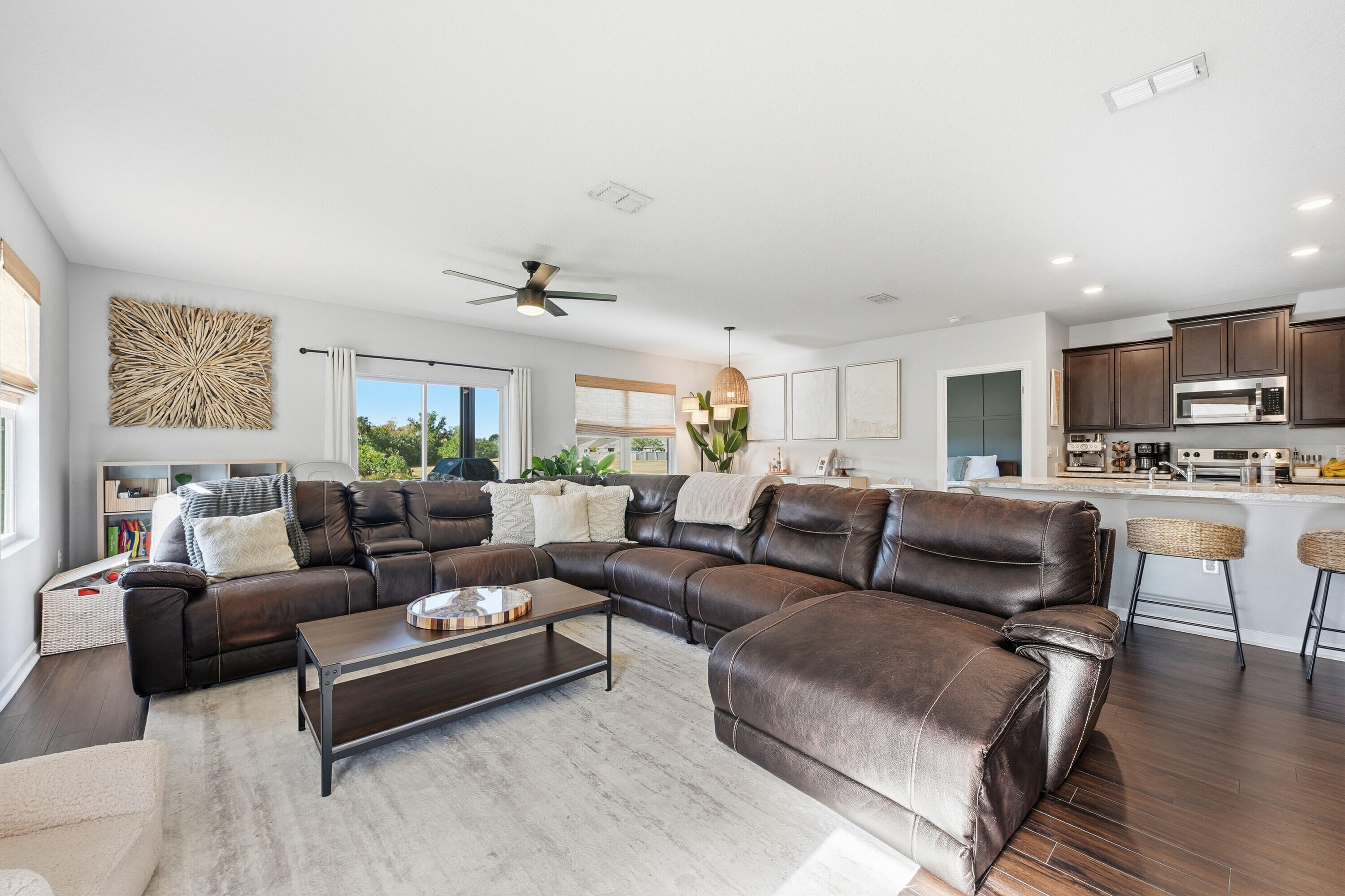 3113 Yellowstone Circle Fort Pierce, FL 34945 - Photo 6 of 33 a living room with furniture and kitchen view