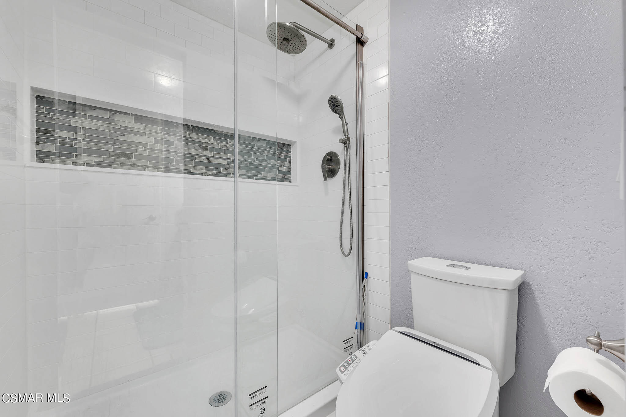 6486 Penn Street, Unit A Moorpark, CA 93021 - Photo 12 of 35 a bathroom with a toilet and a shower