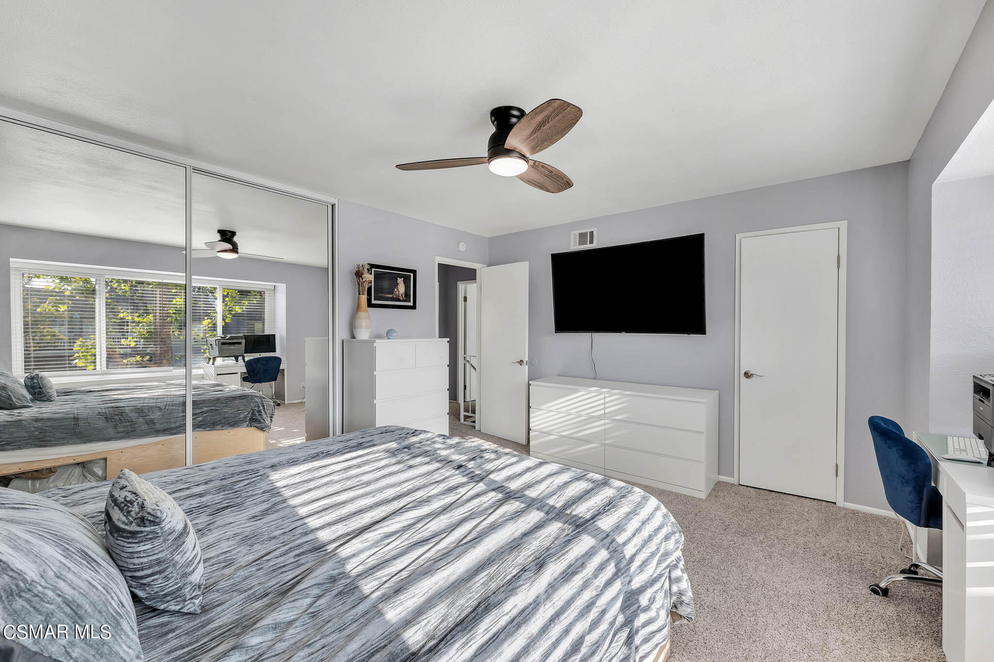 6486 Penn Street, Unit A Moorpark, CA 93021 - Photo 17 of 35 a bedroom with a bed window and a flat screen tv