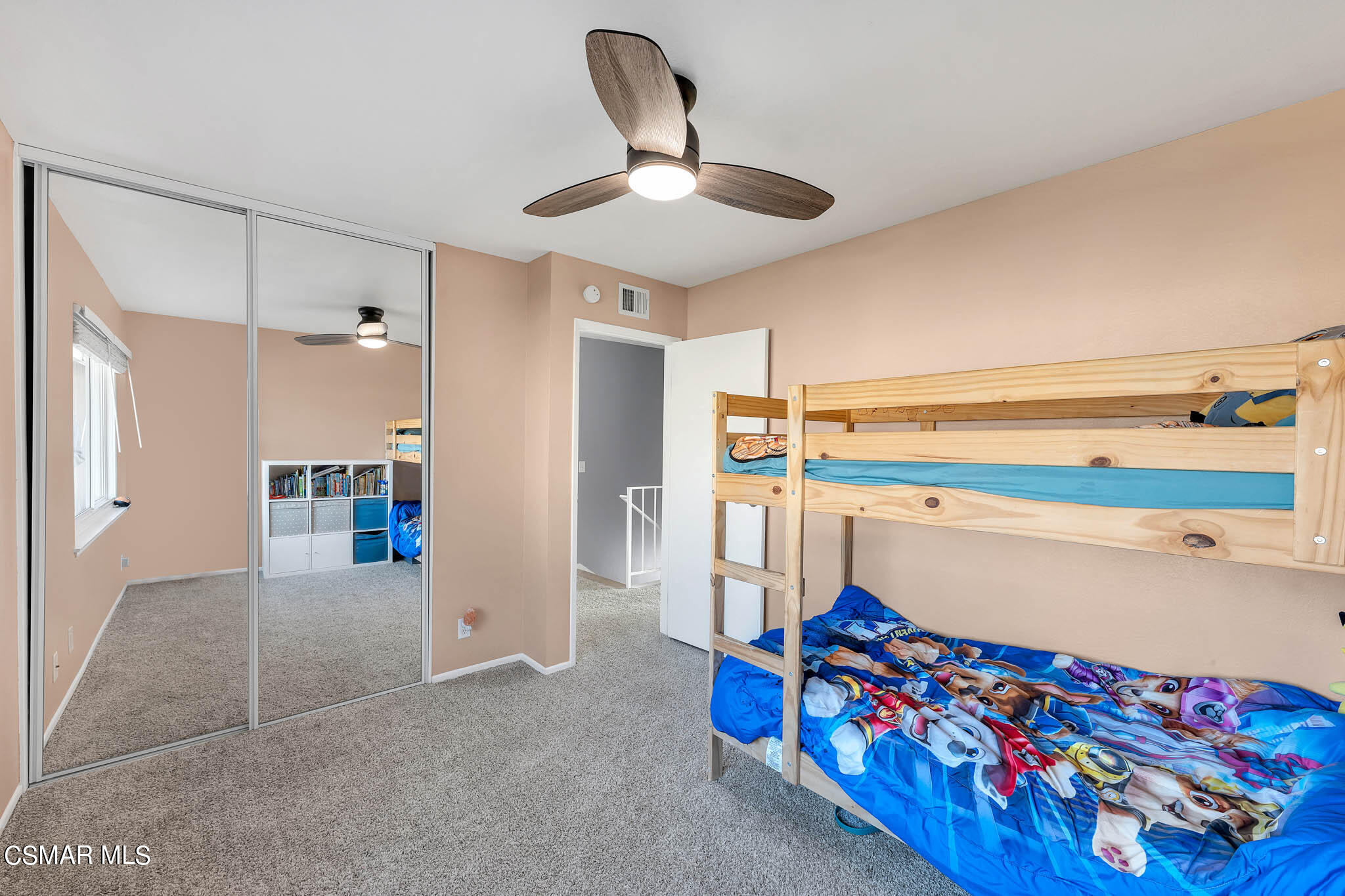 6486 Penn Street, Unit A Moorpark, CA 93021 - Photo 25 of 35 a living room with baby crib furniture and a chandelier