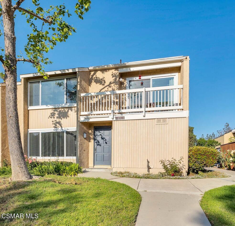 6486 Penn Street, Unit A Moorpark, CA 93021 - Photo 26 of 35 a front view of a house with a yard
