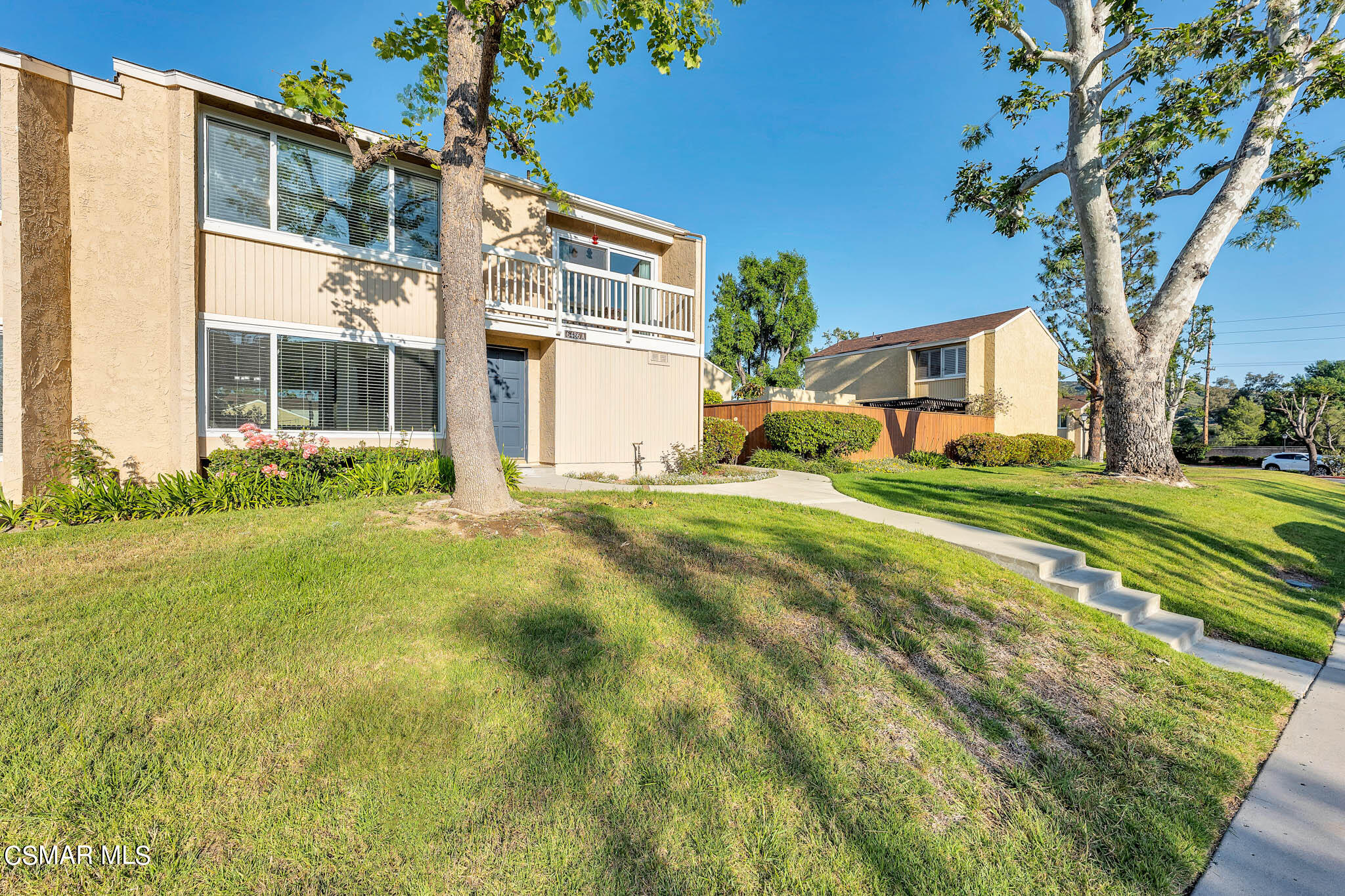 6486 Penn Street, Unit A Moorpark, CA 93021 - Photo 28 of 35 a front view of a house with a yard