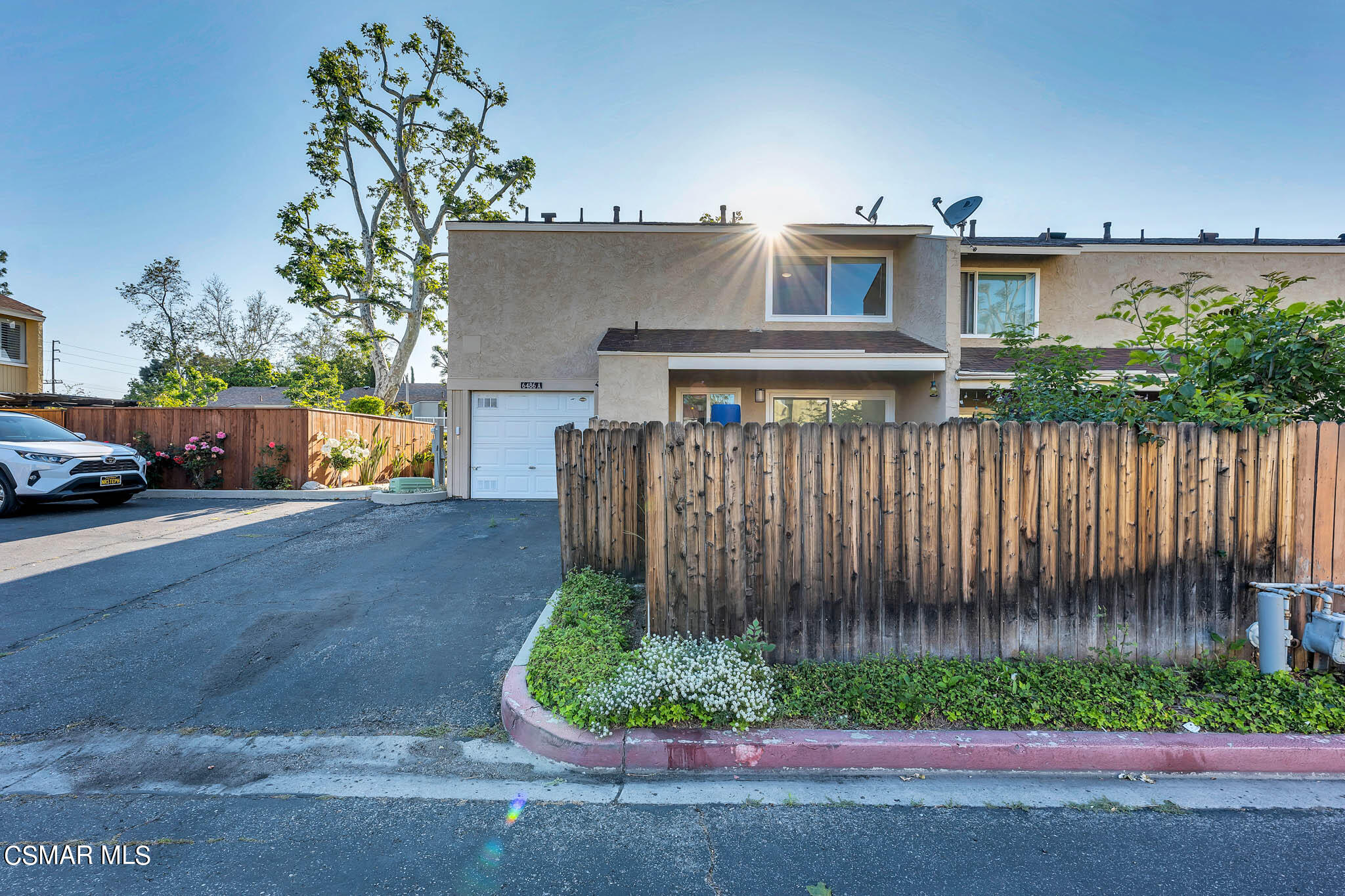 6486 Penn Street, Unit A Moorpark, CA 93021 - Photo 31 of 35 a view of a house with a yard and plants