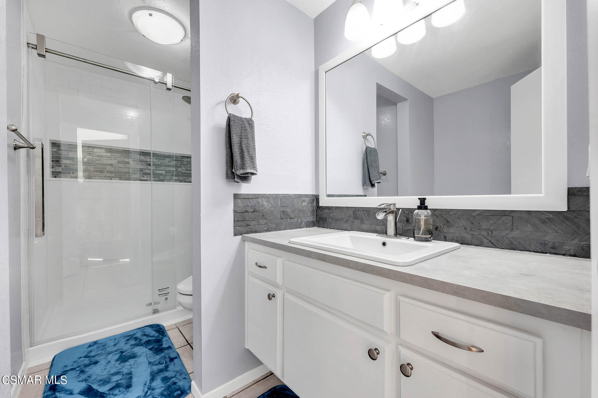 6486 Penn Street, Unit A Moorpark, CA 93021 - Photo 5 of 35 a bathroom with a sink a vanity and a mirror