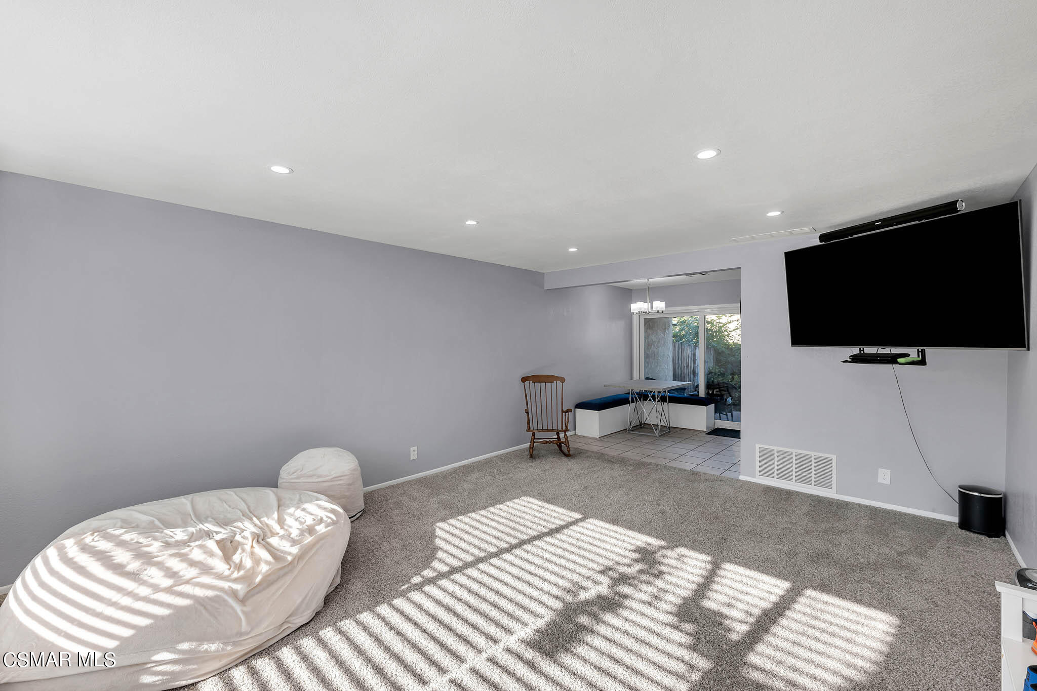 6486 Penn Street, Unit A Moorpark, CA 93021 - Photo 8 of 35 a hotel room with a bed and a flat screen tv