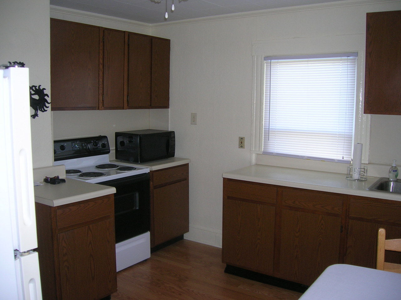 1516 Riverside Terrace Southeast Roanoke, VA 24014 - Photo 8 of 12 a kitchen with a sink a stove and cabinets