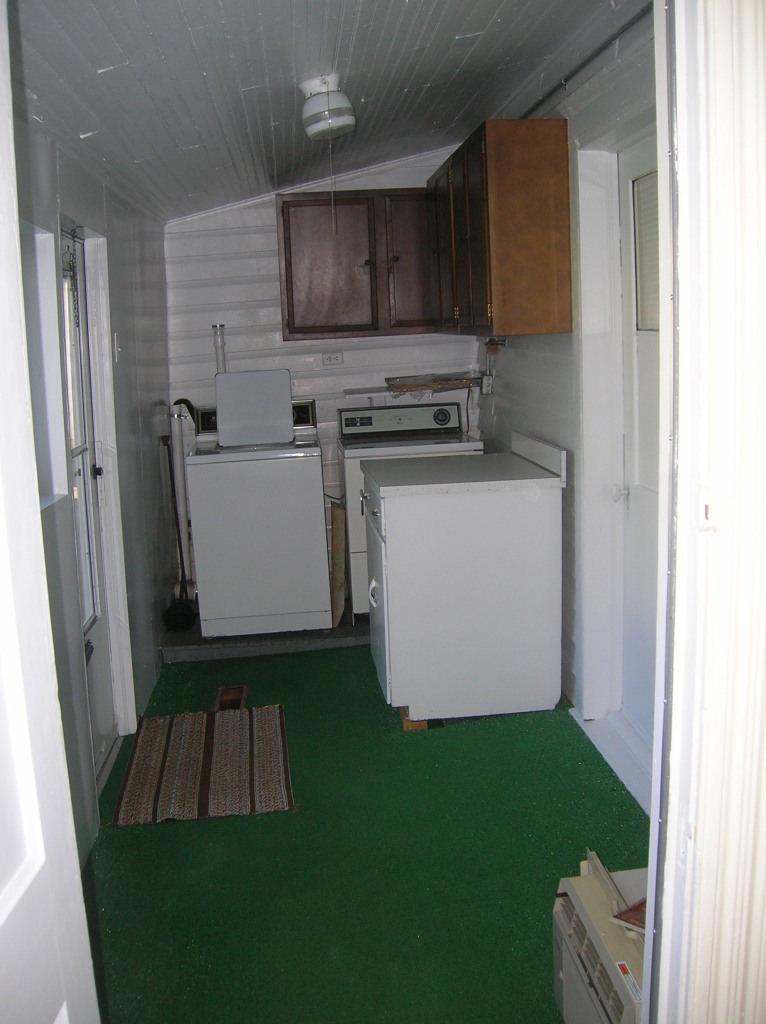 1516 Riverside Terrace Southeast Roanoke, VA 24014 - Photo 9 of 12 a kitchen with a refrigerator and a stove top oven
