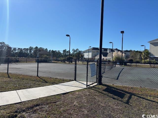 328 Kiskadee Loop, Unit 15C Conway, SC 29526 - Photo 13 of 18 View of tennis court featuring a gate