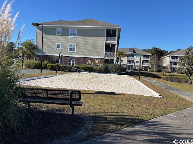 328 Kiskadee Loop, Unit 15C Conway, SC 29526 - Photo 15 of 18 View of community with volleyball court, a water view, and a lawn