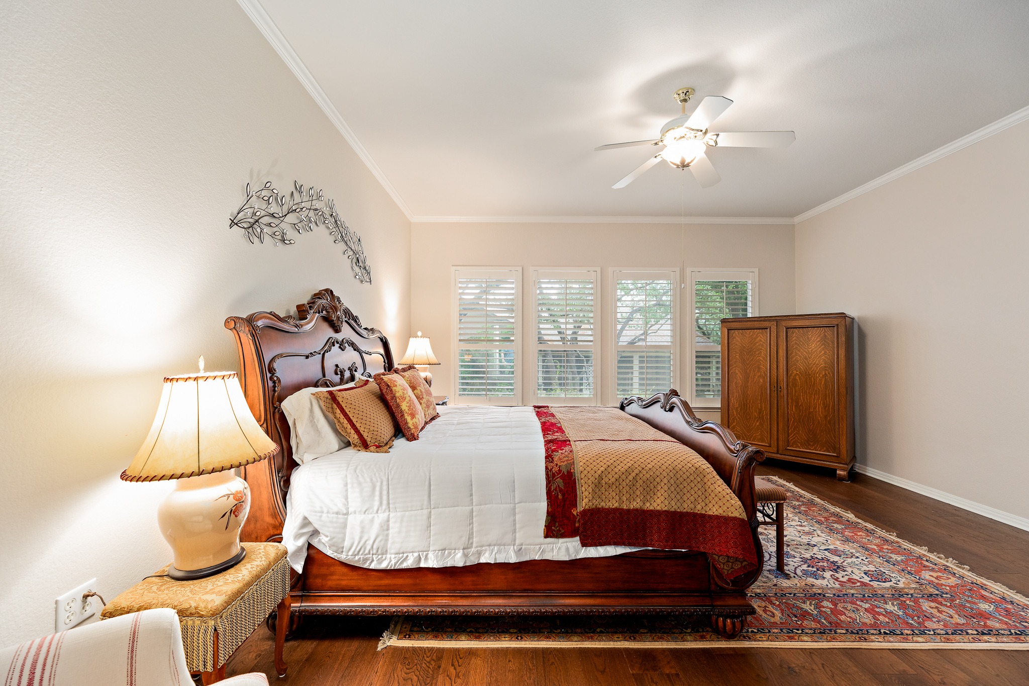 106 Wild Turkey Lane Georgetown, TX 78633 - Photo 24 of 39 a bedroom with a bed and wooden floor