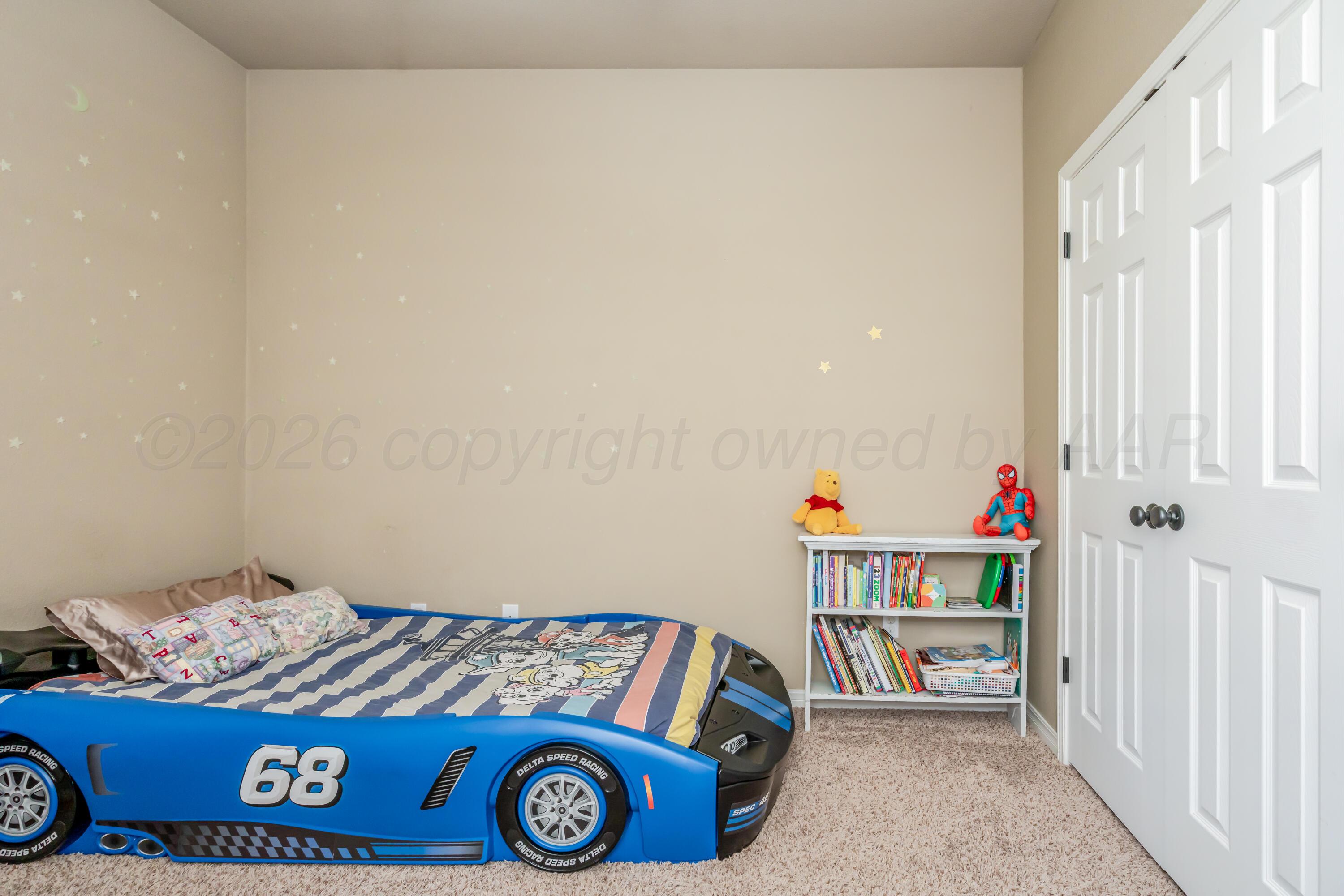 6814 Tivis Street Amarillo, TX 79119 - Photo 16 of 37 a bedroom with a bed and a window