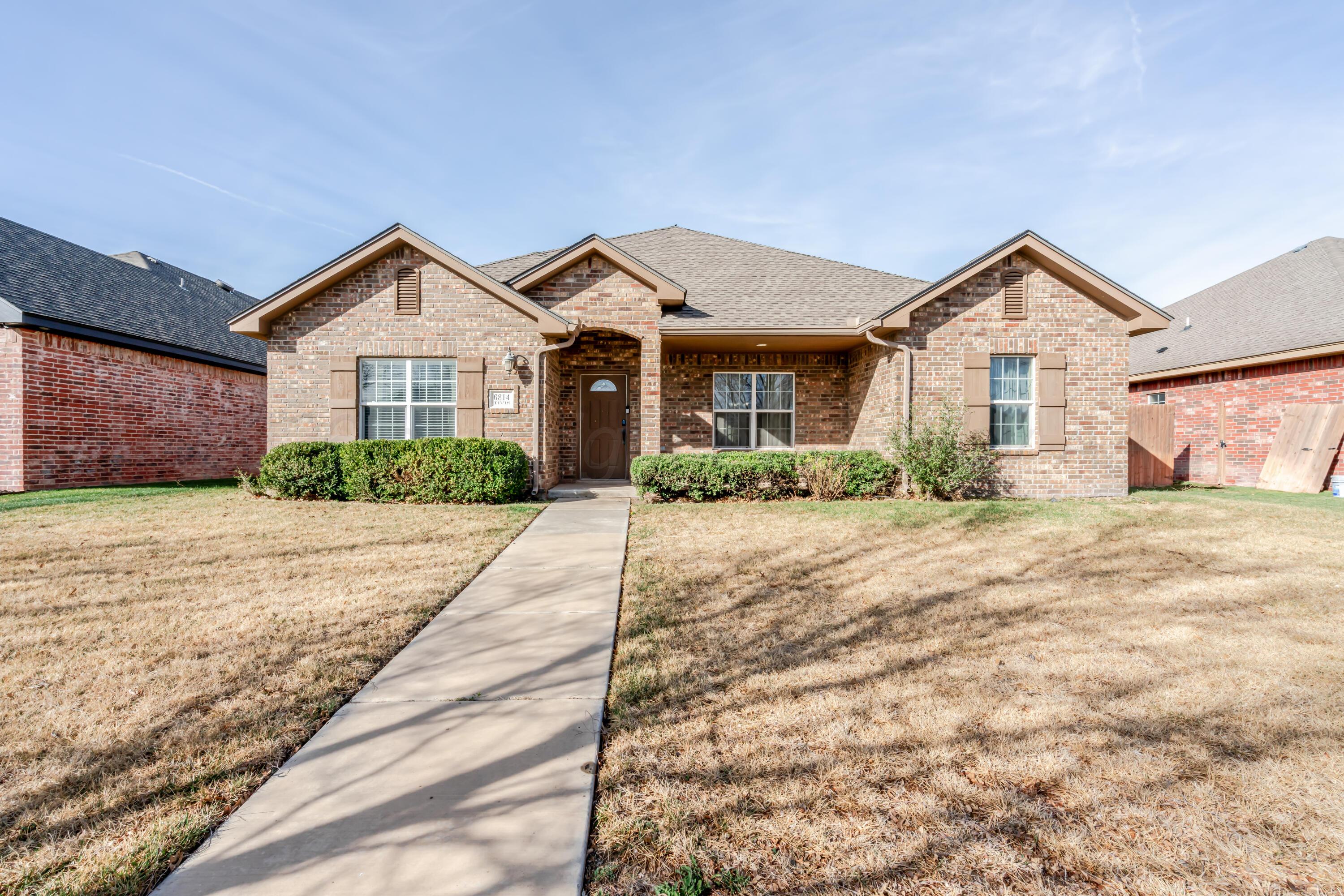 6814 Tivis Street Amarillo, TX 79119 - Photo 35 of 37 a view of a front of house with a yard