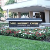 a sign that is in front of flowers