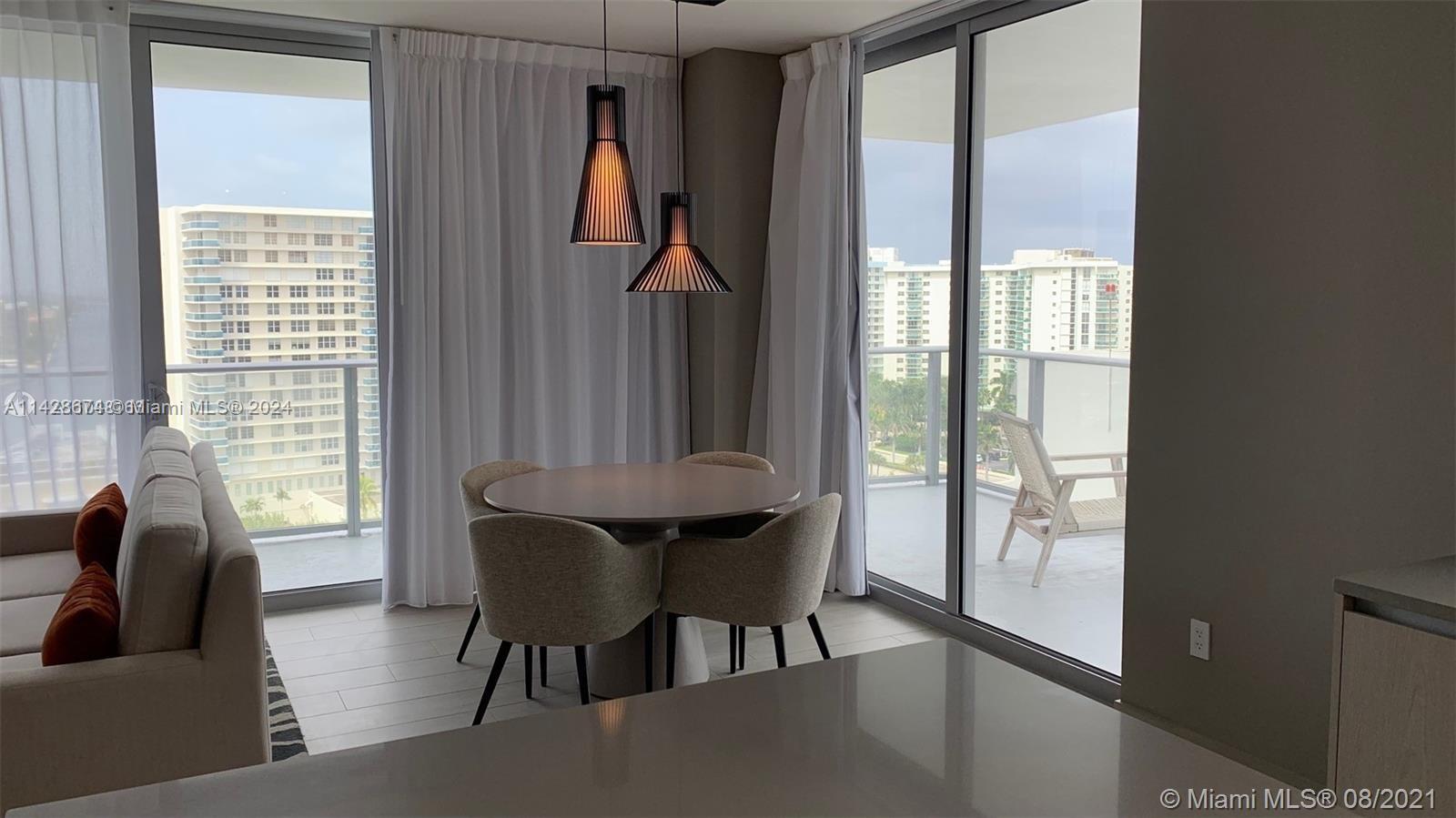 4010 South Ocean Drive, Unit R301 Hollywood, FL 33019 - Photo 7 of 18 a view of a livingroom with furniture and window
