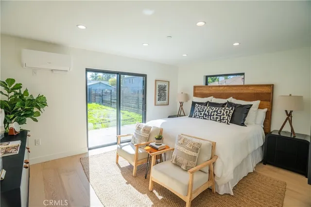 a bathroom with a double vanity sink toilet mirror and shower