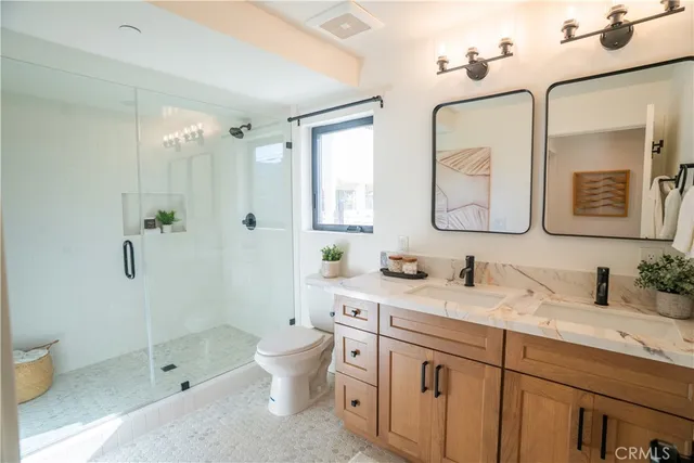 a bedroom with a bed and a potted plant