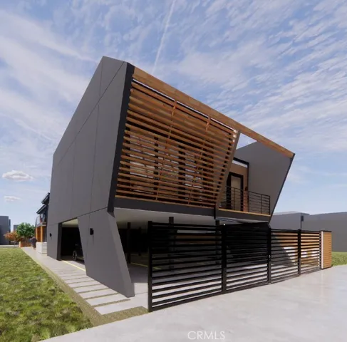 a aerial view of a house with table and chairs