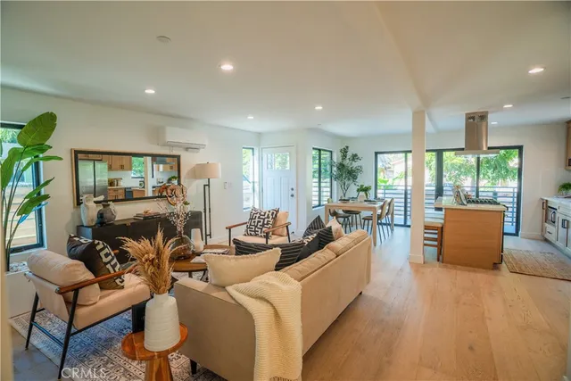 a kitchen that has a table and chairs in it