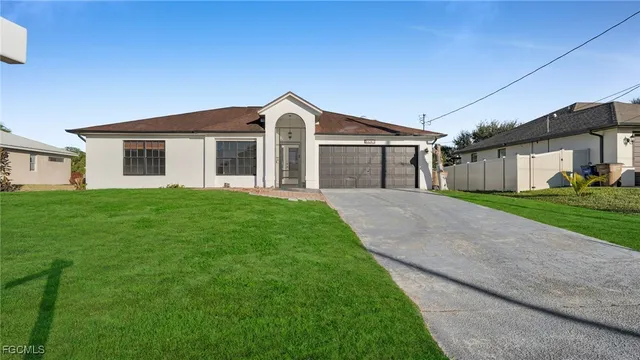 a front view of house with yard and green space