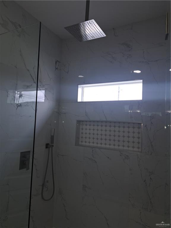 708 East 3rd Avenue Elsa, TX 78543 - Photo 15 of 33 Bathroom view of a marble finish shower